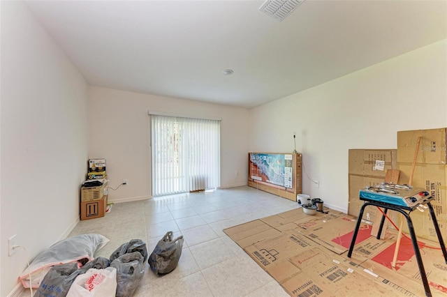 misc room with light tile patterned flooring