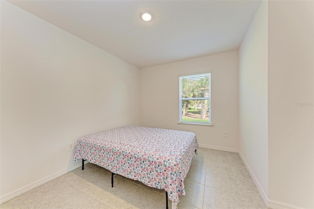 bedroom with light tile patterned flooring