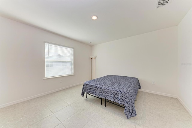 bedroom featuring light tile patterned floors