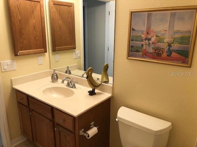 bathroom with vanity and toilet