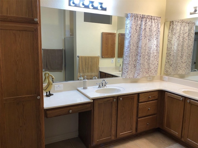 bathroom with tile patterned floors and vanity