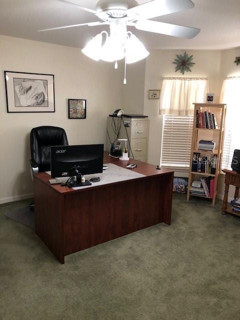 carpeted home office with ceiling fan