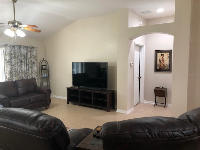 tiled living room with ceiling fan and lofted ceiling