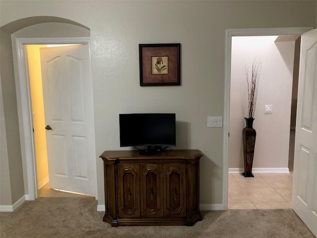 hallway with light tile patterned flooring