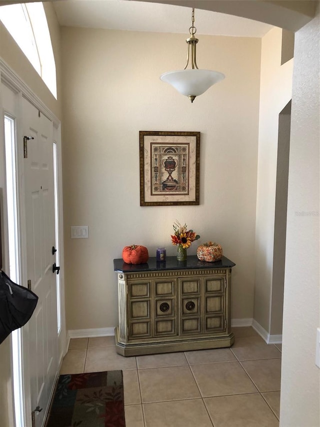 foyer featuring light tile patterned floors