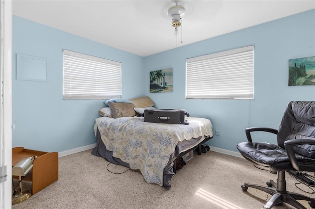 bedroom with light carpet and ceiling fan