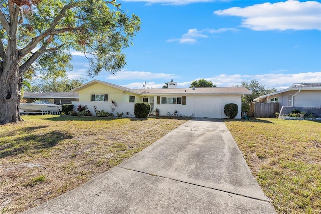 ranch-style house featuring a front lawn