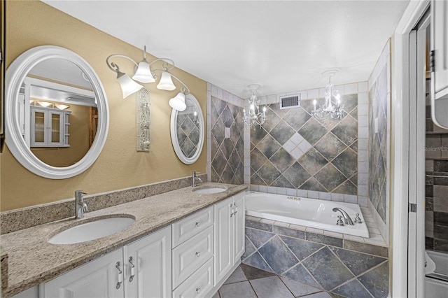 full bathroom featuring a bath, double vanity, a sink, and visible vents