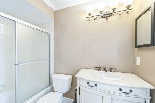 full bath featuring toilet, shower / bath combination with glass door, crown molding, and vanity