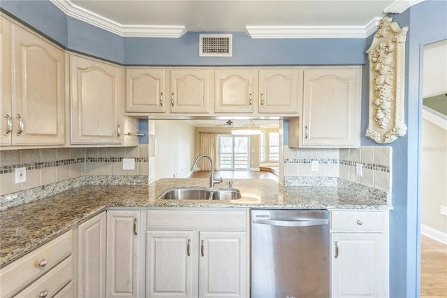 kitchen featuring visible vents, ornamental molding, a sink, light stone countertops, and dishwasher