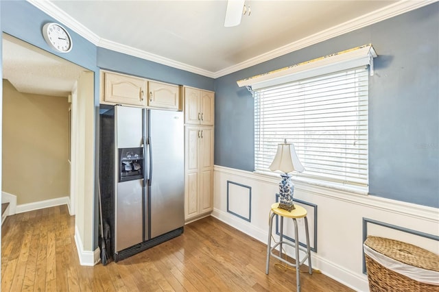 kitchen featuring light brown cabinets, crown molding, stainless steel refrigerator with ice dispenser, and light wood finished floors