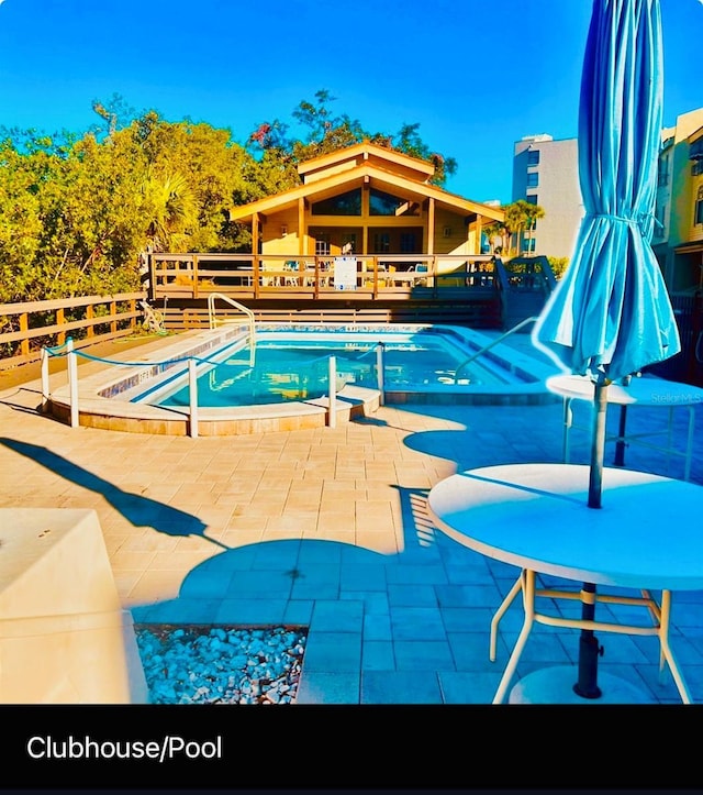 1710 Lighthouse Ter S Unit 1, South Pasadena, FL 33707 - pool featuring a patio