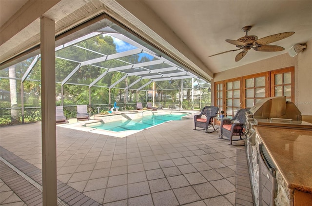 view of swimming pool featuring ceiling fan, area for grilling, a patio area, and glass enclosure