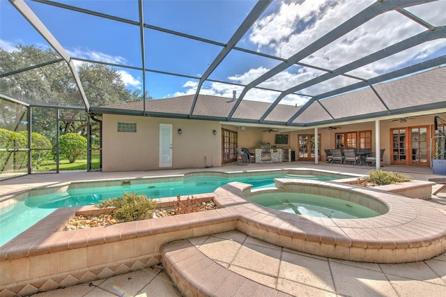 view of pool featuring an in ground hot tub, french doors, ceiling fan, and a lanai