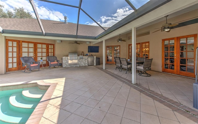 view of patio / terrace featuring a grill, area for grilling, a lanai, and french doors