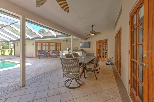 sunroom / solarium with a skylight and ceiling fan