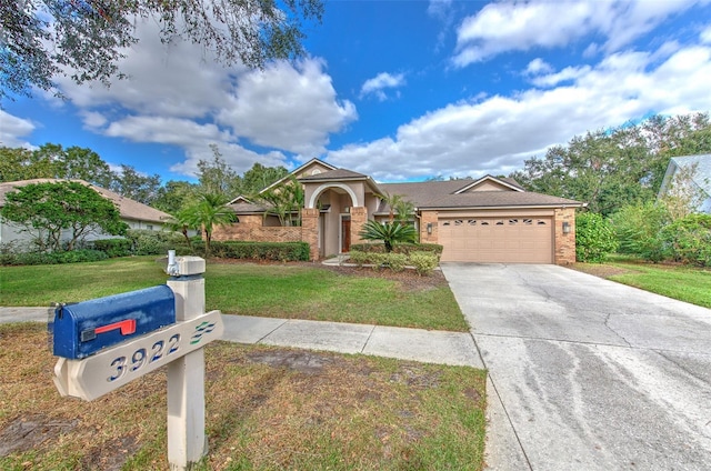 view of front facade with a front yard and a garage