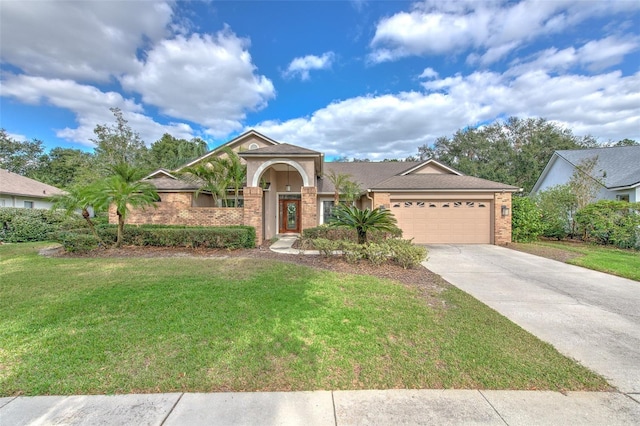 view of front of house featuring a garage and a front lawn