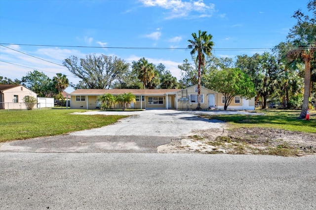 ranch-style house with a front yard