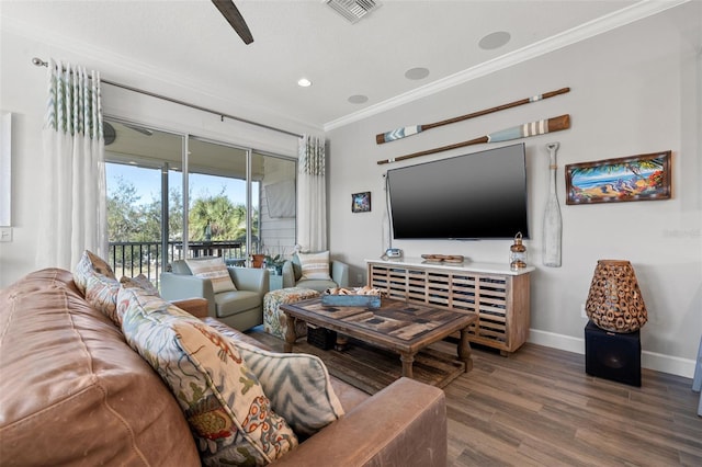 living room featuring ceiling fan, wood-type flooring, and ornamental molding