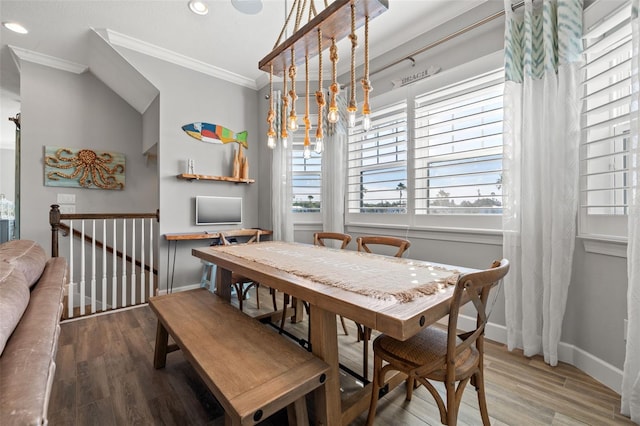 dining room featuring hardwood / wood-style floors and ornamental molding