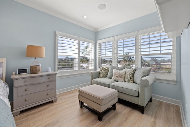 interior space with crown molding and light hardwood / wood-style flooring