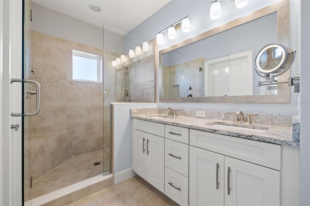 bathroom featuring vanity, tile patterned floors, and an enclosed shower