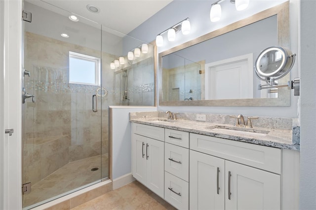 bathroom featuring vanity, tile patterned floors, and an enclosed shower