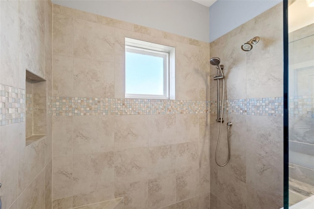 bathroom featuring tiled shower