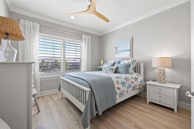 bedroom with ceiling fan, light hardwood / wood-style floors, and ornamental molding