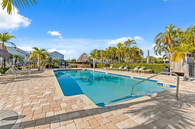 view of swimming pool featuring a patio area