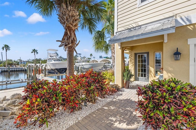 doorway to property featuring a water view