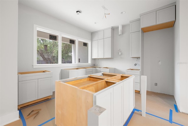 kitchen featuring a center island and white cabinets