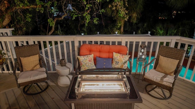 deck featuring an outdoor fire pit