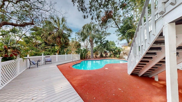 view of pool with a wooden deck