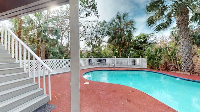 view of swimming pool with a patio