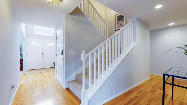 staircase featuring hardwood / wood-style flooring