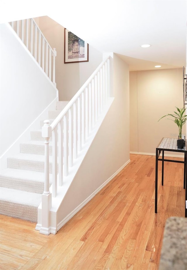 stairway featuring hardwood / wood-style flooring