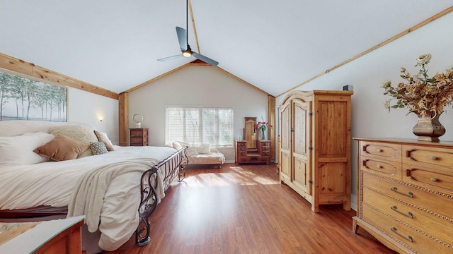 bedroom featuring wood-type flooring, high vaulted ceiling, and ceiling fan