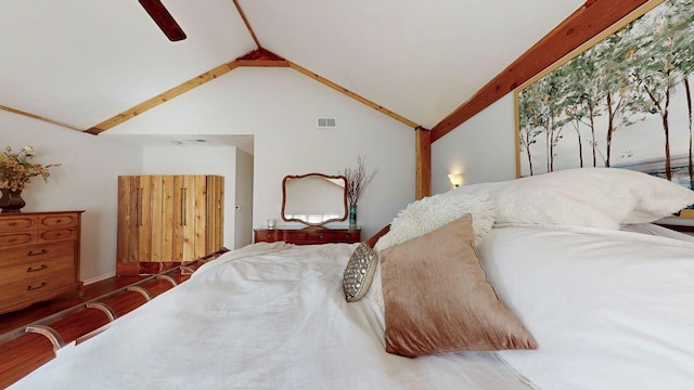 bedroom with wood-type flooring, ceiling fan, and lofted ceiling