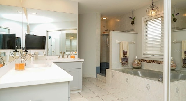 bathroom with separate shower and tub, tile patterned floors, and vanity