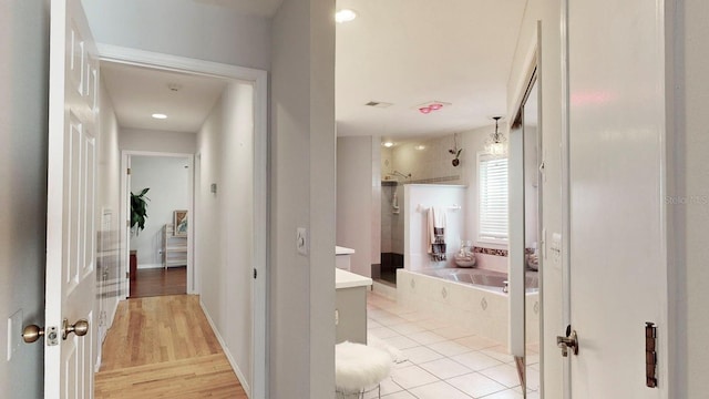 hallway with light wood-type flooring