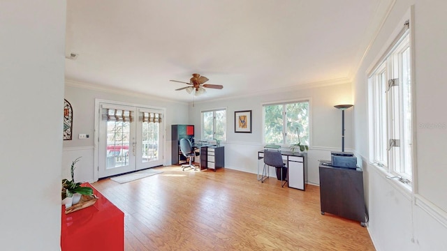 office with french doors, light wood-type flooring, ceiling fan, and ornamental molding