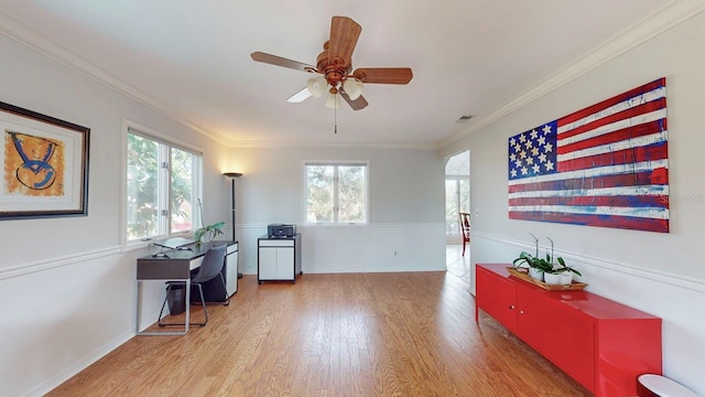 interior space with ceiling fan, a healthy amount of sunlight, crown molding, and light hardwood / wood-style flooring