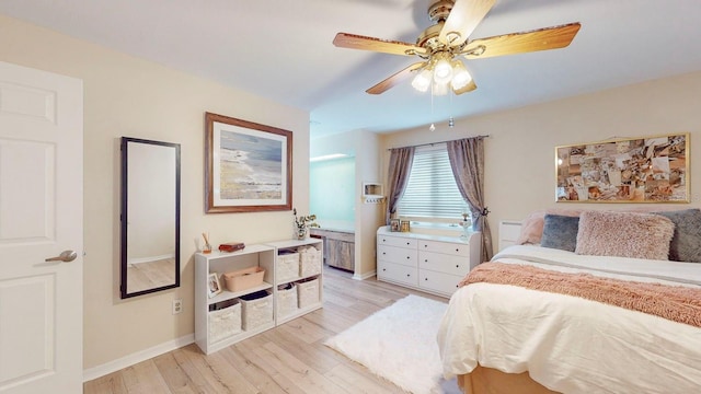 bedroom with ceiling fan and light wood-type flooring