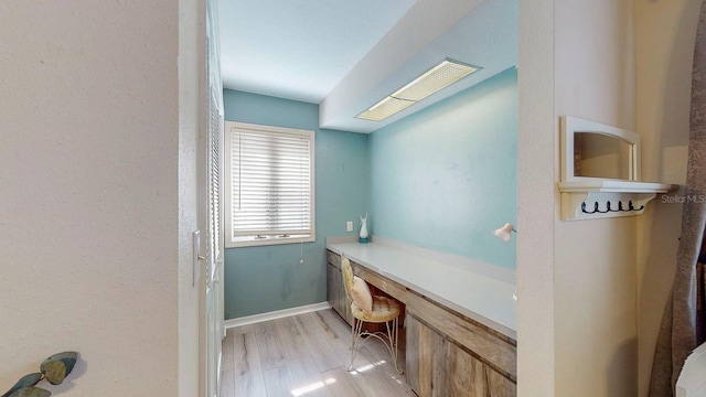 bathroom with hardwood / wood-style floors