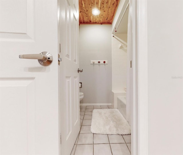 bathroom featuring tile patterned floors, tub / shower combination, toilet, and wooden ceiling