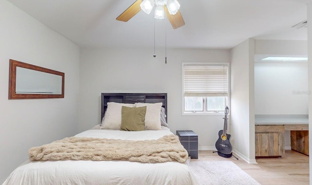 bedroom featuring light wood-type flooring and ceiling fan