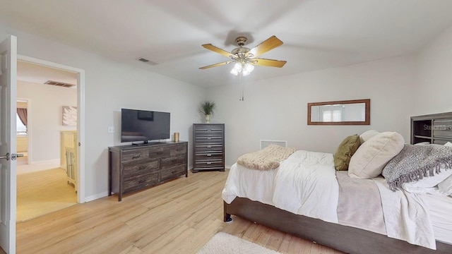 bedroom with ceiling fan and light hardwood / wood-style flooring