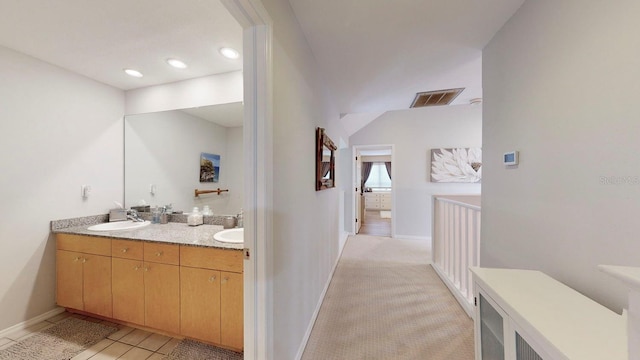 bathroom featuring tile patterned flooring and vanity